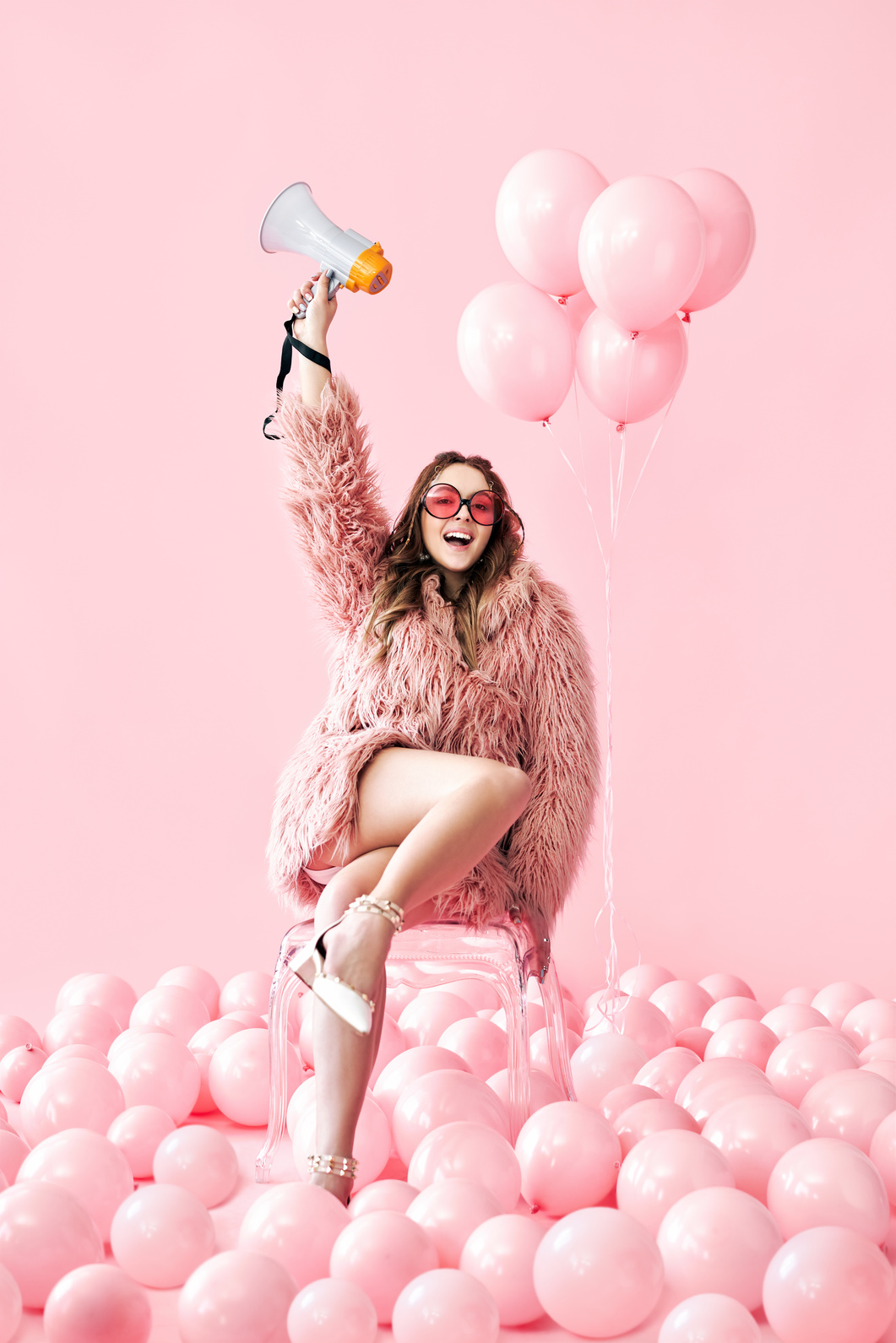 Fashionable Young Woman with Pink Balloons